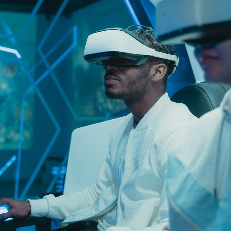 Two individuals wearing virtual reality