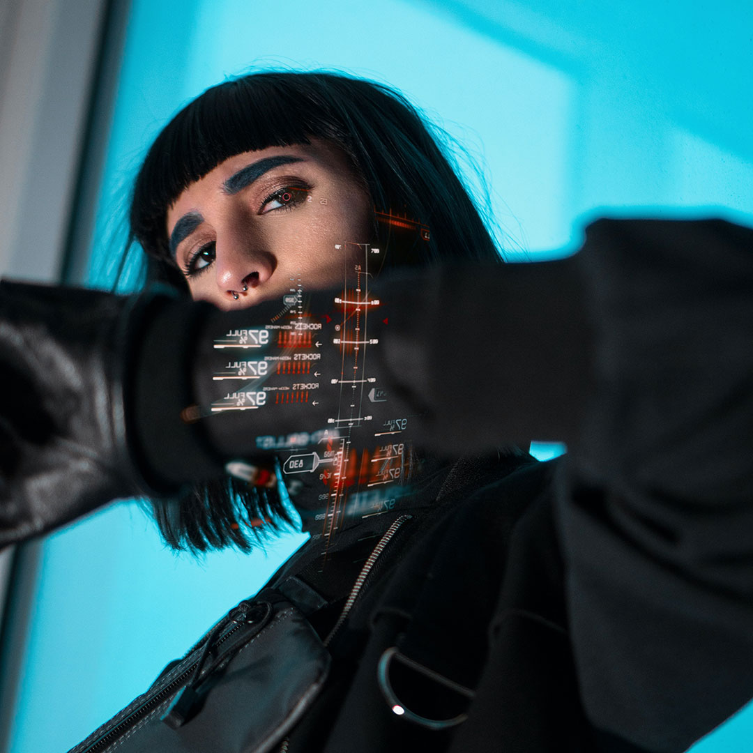 A individual with data visuals overlaid on wrist.